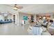 Spacious living room with tiled floors, comfortable couches, and an open concept design at 1200 E Peppertree Ln # 307, Sarasota, FL 34242