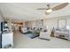 Bright and airy living room with coastal decor, comfortable seating, and an open floor plan at 1200 E Peppertree Ln # 307, Sarasota, FL 34242