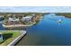 Waterfront property with boat and lush landscaping at 1325 Siesta Bayside Dr # 1325B, Sarasota, FL 34242