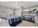 Bedroom with a bunk bed and private balcony at 1325 Siesta Bayside Dr # 1325B, Sarasota, FL 34242