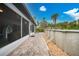 Brick pathway alongside above ground pool in backyard at 1529 Fitzgerald Rd, North Port, FL 34288