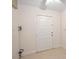 Simple entryway with tiled floors and white door at 1711 N Brink Ave, Sarasota, FL 34234