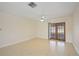 Bright and airy living room with tile floors and French doors at 1711 N Brink Ave, Sarasota, FL 34234