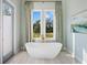 Relaxing bathroom with freestanding tub and natural light at 19405 Ganton Ave, Lakewood Ranch, FL 34202