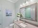 Bathroom with vanity, decorative mirror and shower at 19405 Ganton Ave, Lakewood Ranch, FL 34202