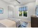 Bright bedroom with double doors and coastal decor at 19405 Ganton Ave, Lakewood Ranch, FL 34202