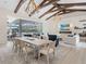 Bright dining room with large table, access to pool area, and living room view at 19405 Ganton Ave, Lakewood Ranch, FL 34202