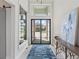 Bright and spacious entryway with a large framed door and stylish decor at 19405 Ganton Ave, Lakewood Ranch, FL 34202