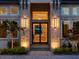 Modern entryway with a striking double door and stone facade at 19405 Ganton Ave, Lakewood Ranch, FL 34202