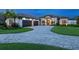 Stunning luxury home with a three-car garage and beautifully landscaped yard at 19405 Ganton Ave, Lakewood Ranch, FL 34202