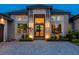 Elegant home entrance with a modern double door and stone accents at 19405 Ganton Ave, Lakewood Ranch, FL 34202