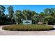 Attractive entrance to a golf clubhouse with landscaping and signage at 19405 Ganton Ave, Lakewood Ranch, FL 34202