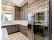 Modern kitchen with stainless steel refrigerator and ample wood cabinetry at 19405 Ganton Ave, Lakewood Ranch, FL 34202