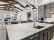 Open kitchen features a large island with seating and modern cabinetry at 19405 Ganton Ave, Lakewood Ranch, FL 34202