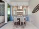Elegant outdoor kitchen with stainless steel appliances and built-in seating at 19405 Ganton Ave, Lakewood Ranch, FL 34202
