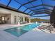 Luxury pool and spa with covered patio offering stunning lake views at 19405 Ganton Ave, Lakewood Ranch, FL 34202
