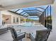 Stunning pool with spa and covered patio offering scenic lake views at 19405 Ganton Ave, Lakewood Ranch, FL 34202