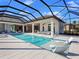 Luxury pool and patio with covered cabana and ample seating at 19405 Ganton Ave, Lakewood Ranch, FL 34202