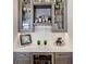 Built-in wet bar with wine storage and quartz countertop at 19405 Ganton Ave, Lakewood Ranch, FL 34202