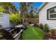 Relaxing backyard oasis with artificial turf and seating area at 213 83Rd St # West, Holmes Beach, FL 34217
