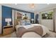 Serene bedroom with a blue accent wall and a comfortable king-size bed at 213 83Rd St # West, Holmes Beach, FL 34217
