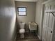 Small bathroom with toilet and utility sink at 25484 Terrain Ln, Punta Gorda, FL 33983