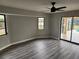Spacious bedroom with hardwood floors and large windows at 25484 Terrain Ln, Punta Gorda, FL 33983