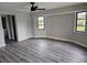 Bright bedroom with hardwood floors and access to bathroom at 25484 Terrain Ln, Punta Gorda, FL 33983