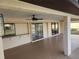 Spacious covered patio with pool access and ceiling fans at 25484 Terrain Ln, Punta Gorda, FL 33983