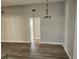 Spacious dining room with hardwood floors and chandelier at 25484 Terrain Ln, Punta Gorda, FL 33983