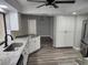 Updated kitchen with white cabinets, granite counters, and stainless steel appliances at 25484 Terrain Ln, Punta Gorda, FL 33983