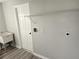 Laundry room with utility sink, shelving and vinyl flooring at 25484 Terrain Ln, Punta Gorda, FL 33983