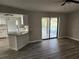 Open living area with pool view and sliding glass doors at 25484 Terrain Ln, Punta Gorda, FL 33983