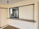 Granite countertop wet bar with sliding window overlooking pool at 25484 Terrain Ln, Punta Gorda, FL 33983