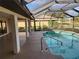 Screened-in pool area with a tiled pool and a covered patio at 25484 Terrain Ln, Punta Gorda, FL 33983