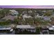 Beautiful waterfront property showcasing a private pool and dock at sunset at 4611 Shark Dr, Bradenton, FL 34208