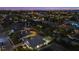Night view of a waterfront home with pool and canal access at 4611 Shark Dr, Bradenton, FL 34208