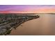 Wide shot of waterfront homes at sunset, showcasing desirable location at 4611 Shark Dr, Bradenton, FL 34208