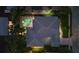 Night view of a home with pool and lush landscaping at 4611 Shark Dr, Bradenton, FL 34208