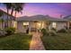 Home features a backyard with patio, landscaping, and pool at 4611 Shark Dr, Bradenton, FL 34208