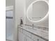 Bathroom boasts a large oval mirror and a walk-in shower at 4611 Shark Dr, Bradenton, FL 34208