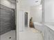 Bathroom with freestanding tub, walk-in shower, and double vanity at 4611 Shark Dr, Bradenton, FL 34208