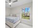 Cozy bedroom with a white platform bed and water view at 4611 Shark Dr, Bradenton, FL 34208