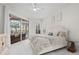 Relaxing bedroom with a queen-size bed and access to the pool area at 4611 Shark Dr, Bradenton, FL 34208