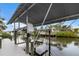 Covered boat lift on a spacious dock at 4611 Shark Dr, Bradenton, FL 34208