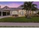 House exterior at dusk with landscaping at 4611 Shark Dr, Bradenton, FL 34208