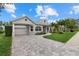 Single-story house with paver driveway and landscaping at 4611 Shark Dr, Bradenton, FL 34208