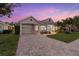 House exterior at dusk with landscaping at 4611 Shark Dr, Bradenton, FL 34208