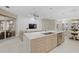 Eat-in kitchen with light wood island and stainless steel appliances at 4611 Shark Dr, Bradenton, FL 34208
