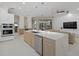 Modern kitchen with large island, stainless steel appliances, and white cabinets at 4611 Shark Dr, Bradenton, FL 34208